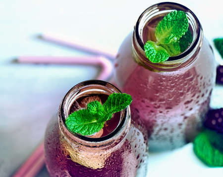 Stylized photo of summer detox blackberry and mint cooler