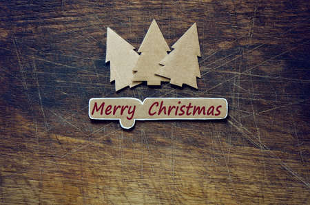 Cardboard Christmas trees decorations, greeting card, stylized photo