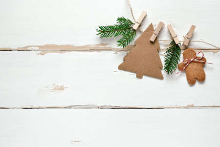 Rustic wooden background decorated with simple handmade decorations and gingerbreadの写真素材
