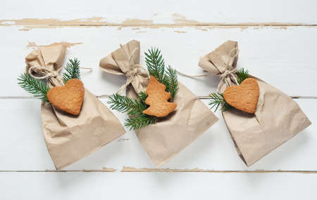 Handmade presents decorated with  Christmas gingerbreads, stylized imageの写真素材