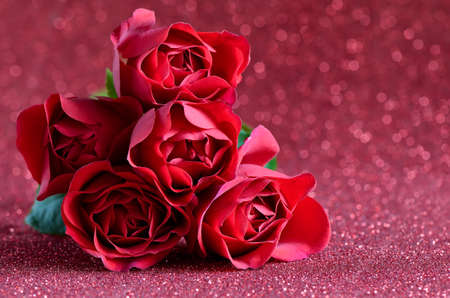 Red roses bouquet on a sparkling background, Valentine's Day conceptの写真素材
