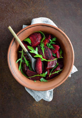Beetroot and fresh arugula salad, overhead view