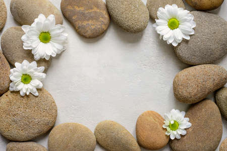 Spa background with stones and white flowersの写真素材