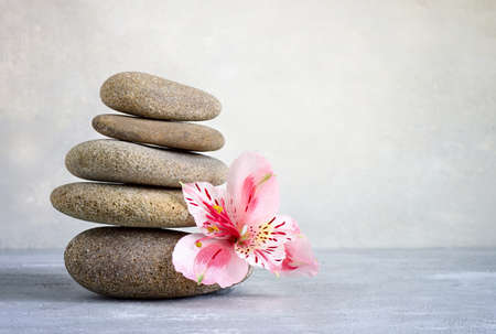 Spa stones stack with a flower, spa conceptの写真素材