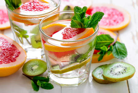 Infused water with grapefruit kiwi and mint, refreshing vitamin C cooler, perfect spa drinkの写真素材