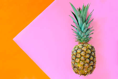 Pineapple on a stylized bright background, summer concept