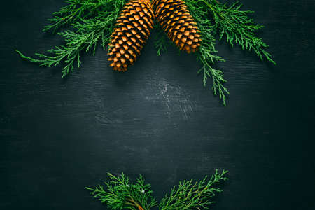 Noel or Xmas holiday background, dark and moody, grunge rustic black board with a space for a...