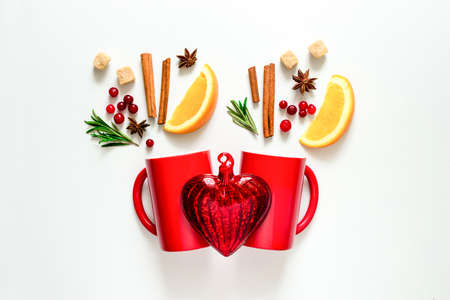 Winter warmer drink concept, two cups with warming alcohol cocktail recipe ingredients, winter holidays drink, flat lay, view from aboveの写真素材