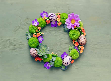 Easter concept, wreath made of eggs and flowers, top viewの写真素材