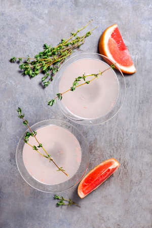 Grapefruit and thyme gin cocktail, vie from aboveの写真素材