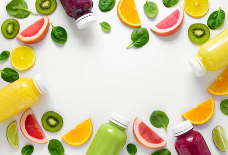 Various kind of smoothies or juices in bottles, healthy diet food concept, view from aboveの写真素材