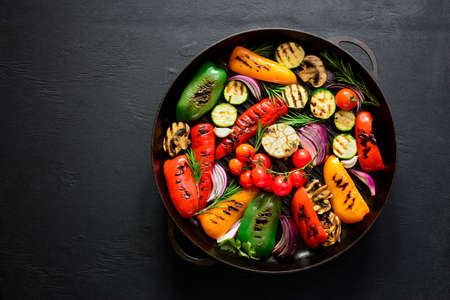 Grilled vegetables in a cast iron grilling pan, view from above, space fora textの写真素材