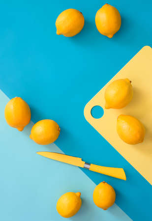Lemons on a kitchen table, minimal cooking concept, view from above, space for a textの写真素材