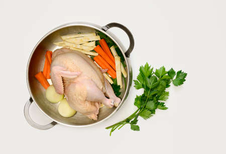 Chicken bouillon set, ingredients for cooking simple chicken bouillon put in a pan, view from aboveの写真素材