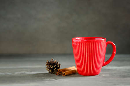 Christmas or New Year winter holidays warming cpicy drink in red cupの写真素材