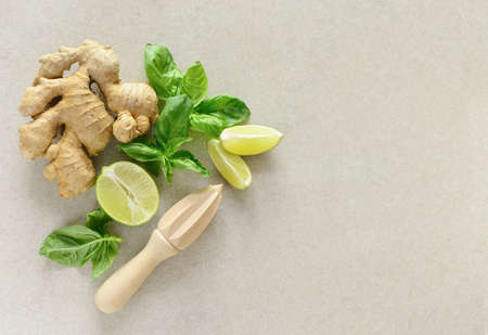 Basil and ginger limeade ingredients, overhead view, flat lay composition with a space for a textの写真素材