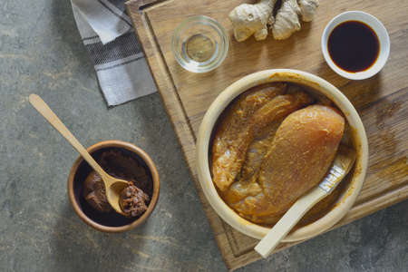 Miso marinated chicken breasts in a process of cooking, view from aboveの写真素材