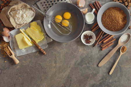 Baking ingredients arranged on a kitchen table stone desktop, high angle view, space for a textの写真素材
