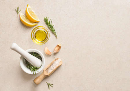 Sea salt scented with fresh rosemary and garlic, culinary concept, view from above, space for a textの写真素材