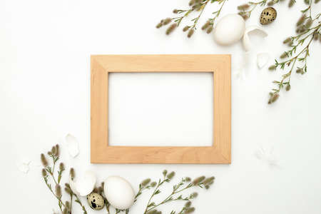 Easter greeting card or ad mock-up with a space for a text in the frame, flat lay compositionの写真素材