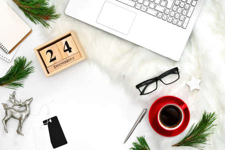 Winter holidays flat lay concept of blogger's working space, Christmas mood on an office table, view from above, blank space for a textの写真素材