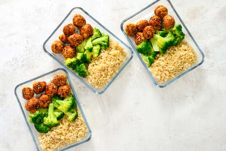 Meatballs and broccoli and rice lunch boxes cooked in advance and ready to be frozen or to be served...