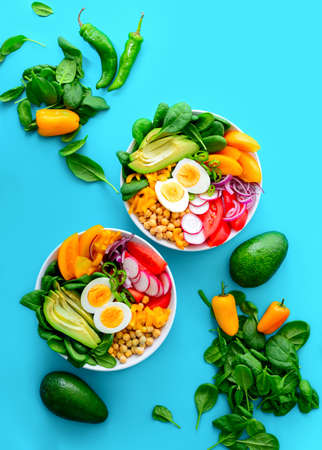 Buddha bowl salad in two bowls, healthy eating concept, view from aboveの写真素材