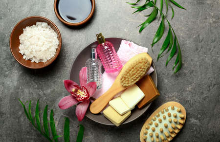 Luxury hygene set with natural soap, sea salt and massage brushes for spa treatment, top viewの写真素材
