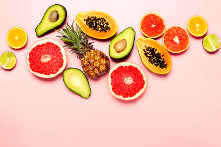 Summer tropical fruits, healthy eating vitamin concept, flat lay composition, space for a textの写真素材