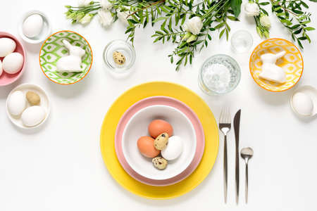 Easter dinner table setting, home holiday decor concept, view from aboveの写真素材
