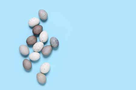 Naturally dyed Easter eggs background with copy space for a greeting text