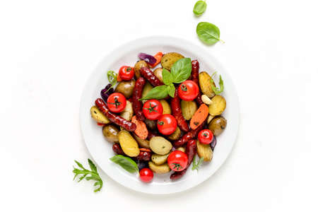 Sausages roasted with potatoes, view from aboveの写真素材