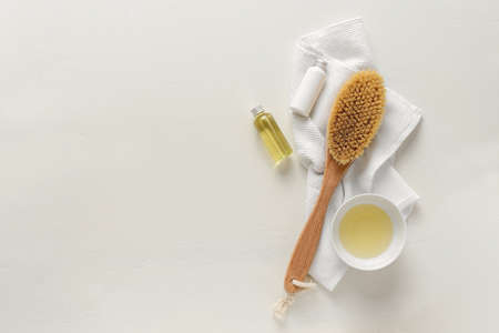 Wooden brush for dry brushing anticellulite massage, spa concept, flat lay beauty background with copy spaceの写真素材
