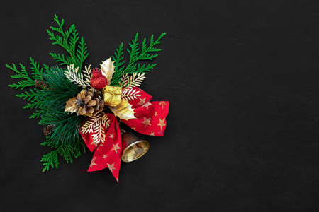 Noel or Christmas dark background with traditional decor element and blank space for a greeting textの写真素材