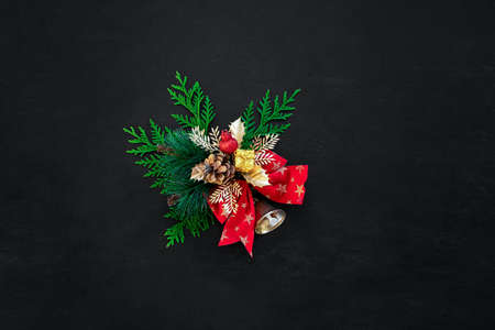 Noel or Christmas dark background with traditional decor element and blank space for a greeting textの写真素材