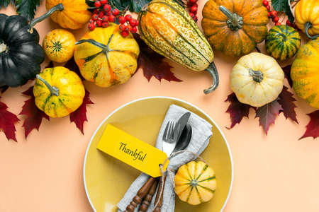 Thanksgiving table setting concept, overhead view on natural fall decor of festive dinner decoration ideaの写真素材