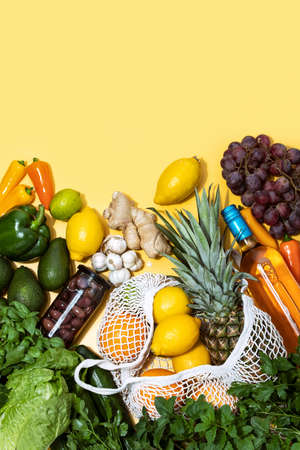 Summer food shopping concept, top-down view of fruits vegetables and wine bottle, healthy ingredients for cooking dinner at home, blank space for a text aboveの写真素材