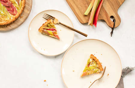 Rhubarb open faced pie served on two plates, overhead view, summer season food conceptの写真素材