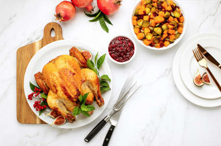 Roasted poultry ready to serve with fall season brussels sprout salad, top-down viewの写真素材