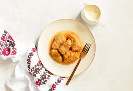 National Ukrainian cuisine dish Golubtsy (rice and meat-stuffed cabbage rolls) served with sour...