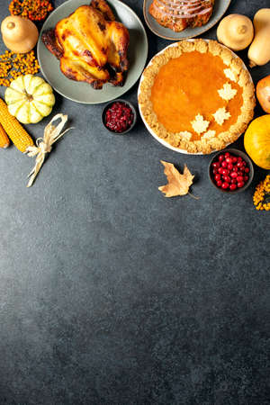 Thanksgiving traditional food for festive charity or family and friends dinner party, top-down view, blank space for a greeting textの写真素材
