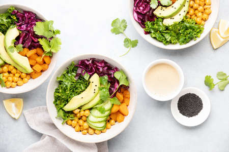 Vegan Buddha bowl with roasted chickpeas and tahini sauce, top down viewの写真素材