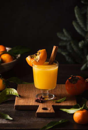 Persimmon and tangerine juice bourbon cocktail, front viewの写真素材