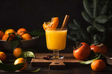 Persimmon and tangerine juice bourbon cocktail, front viewの写真素材