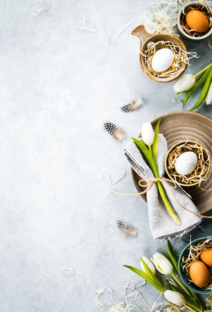 Easter table setting concept background with a space for a greeting textの写真素材