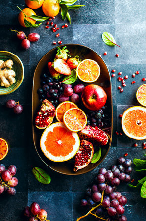 Fruits and berries in an oval dish, view from aboveの写真素材
