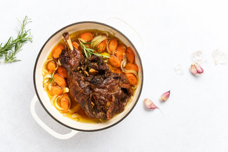 Lamb shoulder slow cooked  in a cast iron pan  on a traditional recipe, top down viewの写真素材