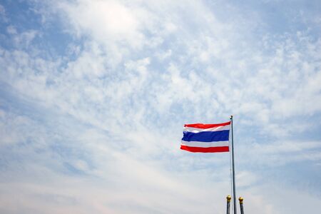 Thailand flag on a pole on the skyの写真素材