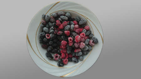 frozen berries in a plateの写真素材