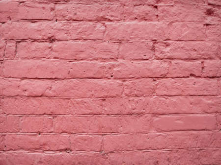 pink brick wall on the streetの写真素材